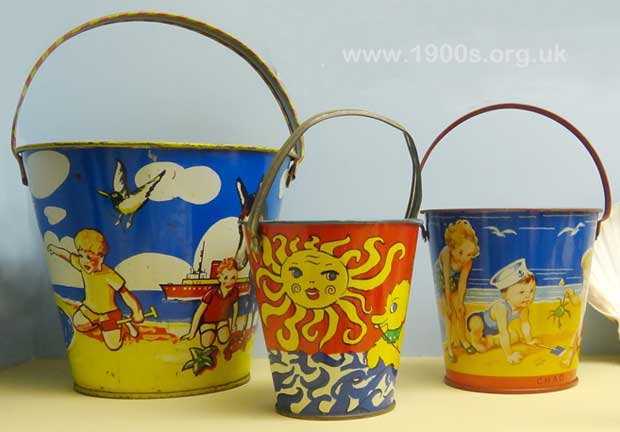 Children's decorated metal buckets for playing in the sand, 1930s
