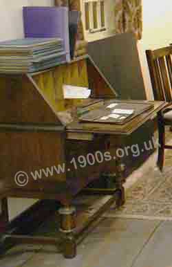 Bureau - a piece of furniture common in the the UK, 1940s and 1950s which stored stationery and documents with a lid that opened to form a flat writing surface.