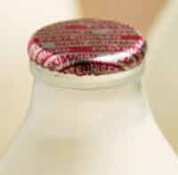 Foil milk bottle top on a glass milk bottle