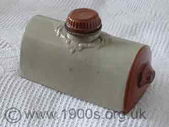 Stone hot water bottle with coloured knobs
