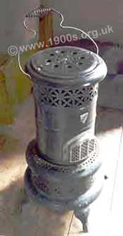 Common form of paraffin heater / oil stove in the mid 20th century - British