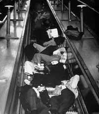 People sleeping on London Underground escalators to shelter from bombs in WW2 