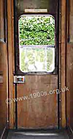 Inside of a train door as common in Britain in the 1940s and 1950s showing its very stiff inside latch