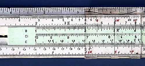 Slide rule with its the sliding scale in the same position but with its cursor slid along to be over the second number to be multiplied so that it also shows the result of the multiplication.