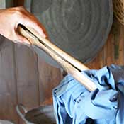 wooden tongs to lift wet clothes