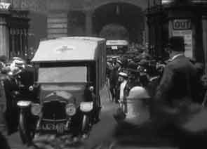 Convoy of ambulances leaving a London station transporting wounded WW1 soldiers to the military hospitals. The red cross is clearly shown on the front of the nearest ambulance