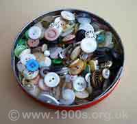A 'button box'- an old tin storing odd buttons