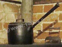 Cast iron saucepan showing its long handle