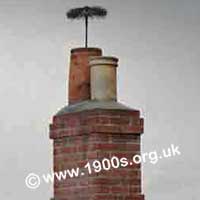 Chimney sweep’s brush poking out of a chimney showing that it had swept the entire height of the chimney