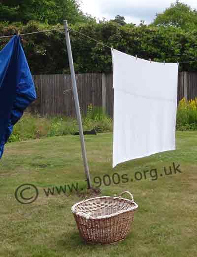 Wooden clothes prop with planed sides and a notch at the top to lock onto the clothes line