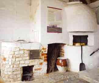 The arrangement in the outhouse at Jane Austen's house in Chawton, whereby the old copper, an old fireplace and an old bread oven all use the same chimney.