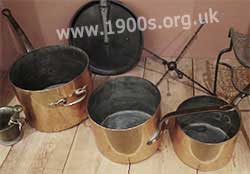 Highly polished copper saucepans