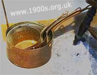 Tarnished copper saucepans