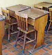 Classroom desks, common in Victorian times to the 1960s, for use with chairs rather than the attached plank-style wooden seats