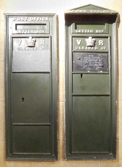 Two examples of green Victorian post boxes