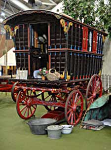A restored gypsy caravan in Milestones Museum, Basingstoke, showing its typical bright colours