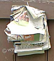 Squares of newspaper on a string, to serve as toilet paper in the early 1900s and before