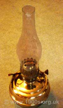 A plain brass oil lamp of the sort used in Victorian times