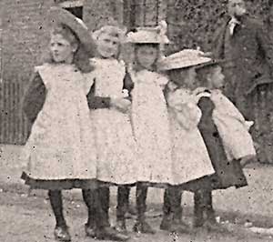 Girls wearing the white pinafores, standard dress, early 1900s