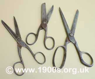 Victorian or Edwardian everyday scissors, blackened and blunted with age and use because they were made of steel which was not stainless.