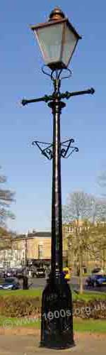 Old gas street lamp showing the bars for the lamplighter's ladder to lean against