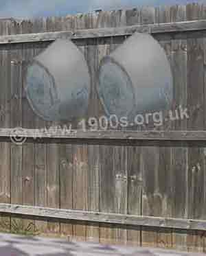 fence in the yard outside a Victorian scullery with tin baths hung up