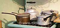 Various old aluminium and copper cooking pots