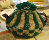 old knitted tea cosy to keep the tea in a teapot hot