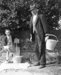 Getting water from a standpipe, early 1940s