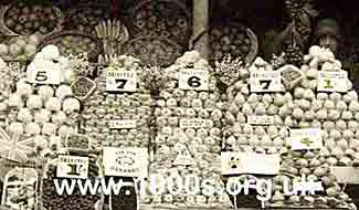 Old London greengrocers display showing the propensity of seasonal goods and the shillings and pence prices