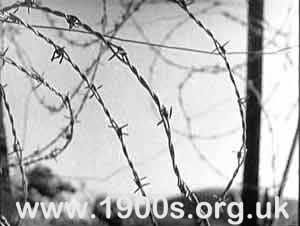 Close-up of barbed wire beach defences, World War Two, England preventing anyone from going beyond them into the seam 2 of 2">