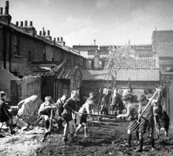 Children playing and searching for goodies on bomb sites during World War Two Britain