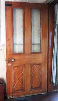 plain wood door, varnished and combed to look like oak