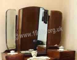 Three mirrors on dark oak dressing table, 1930s and 1940s, England