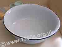 Enamel washing-up bowl, common before the 1950s when plastics came on the market.