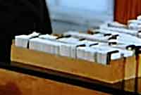 A filing cabinet drawer of library cards on a desk of a library, before computerisation