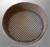 Rusting metal garden sieve