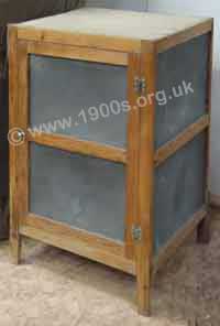 Indoor food safe standing on a floor, also known as a meat-safe, used where there was no fridge, common up to the mid-1900s