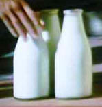 Milk bottles on a doorstep in 1940s Britain