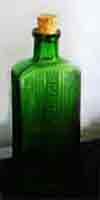 Mid 1900s ridged and coloured glass bottle for poisonous liquid, always ridged glass and usually coloured