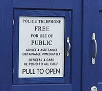 door to public phone in police box