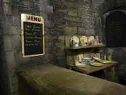 Room off the corridor of the WW2 public shelters under the battlements of Cardiff Castle showing a service counter for selling food and drink,small image
