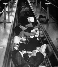 People sleeping on London Underground escalators to shelter from bombs in WW2