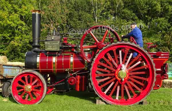 Traction engine powering a threshing machine