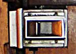Detail of the small and very stiff internal latch/hnadle of train doors, common in 1940s and 1950s Britain