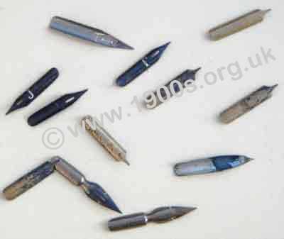 Old pen nibs, used, many stained with blue ink