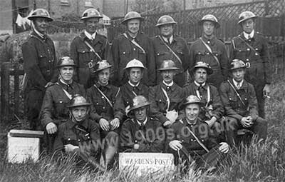 A group of World War Two wardens : air raid wardens, first-aid wardens and a head warden in a white helmet