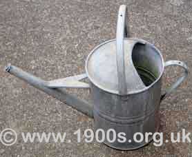 old metal watering can
