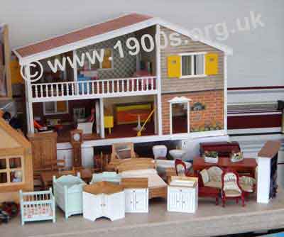 Dolls house, on two floors, opening at the front, common in mid 20th century