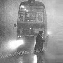 Lighting the way for a London bus in a fog/smog